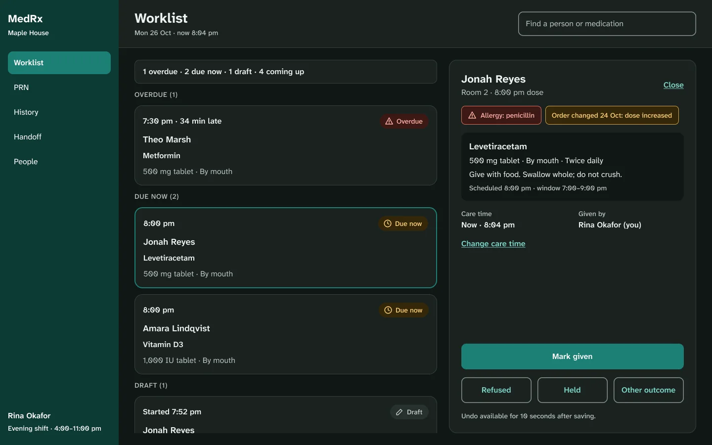 The web worklist in dark mode with the same layout, status chips and safety chips.